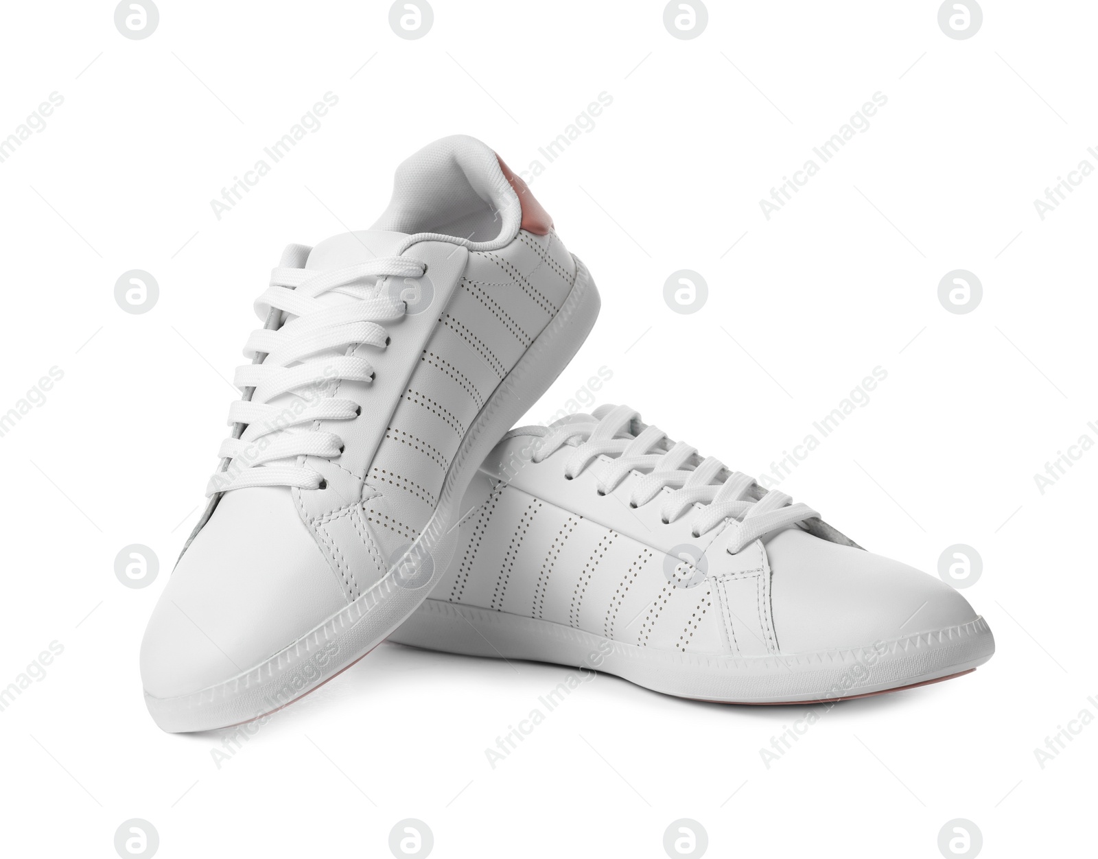 Photo of Pair of trendy sneakers on white background