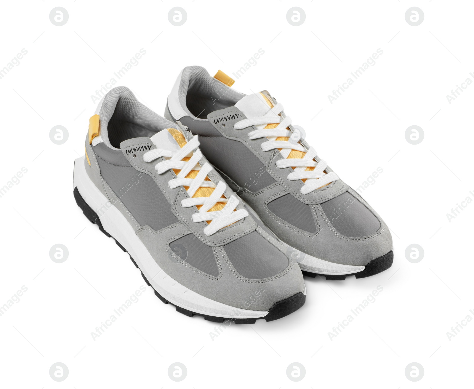 Photo of Pair of stylish grey sneakers isolated on white