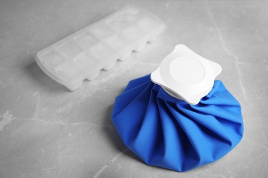 Photo of Composition with ice pack on marble table