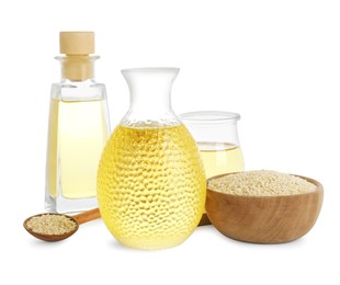 Photo of Fresh sesame oil and seeds isolated on white