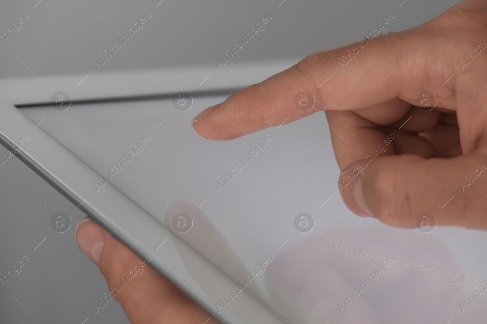 Photo of Closeup view of man using new tablet indoors