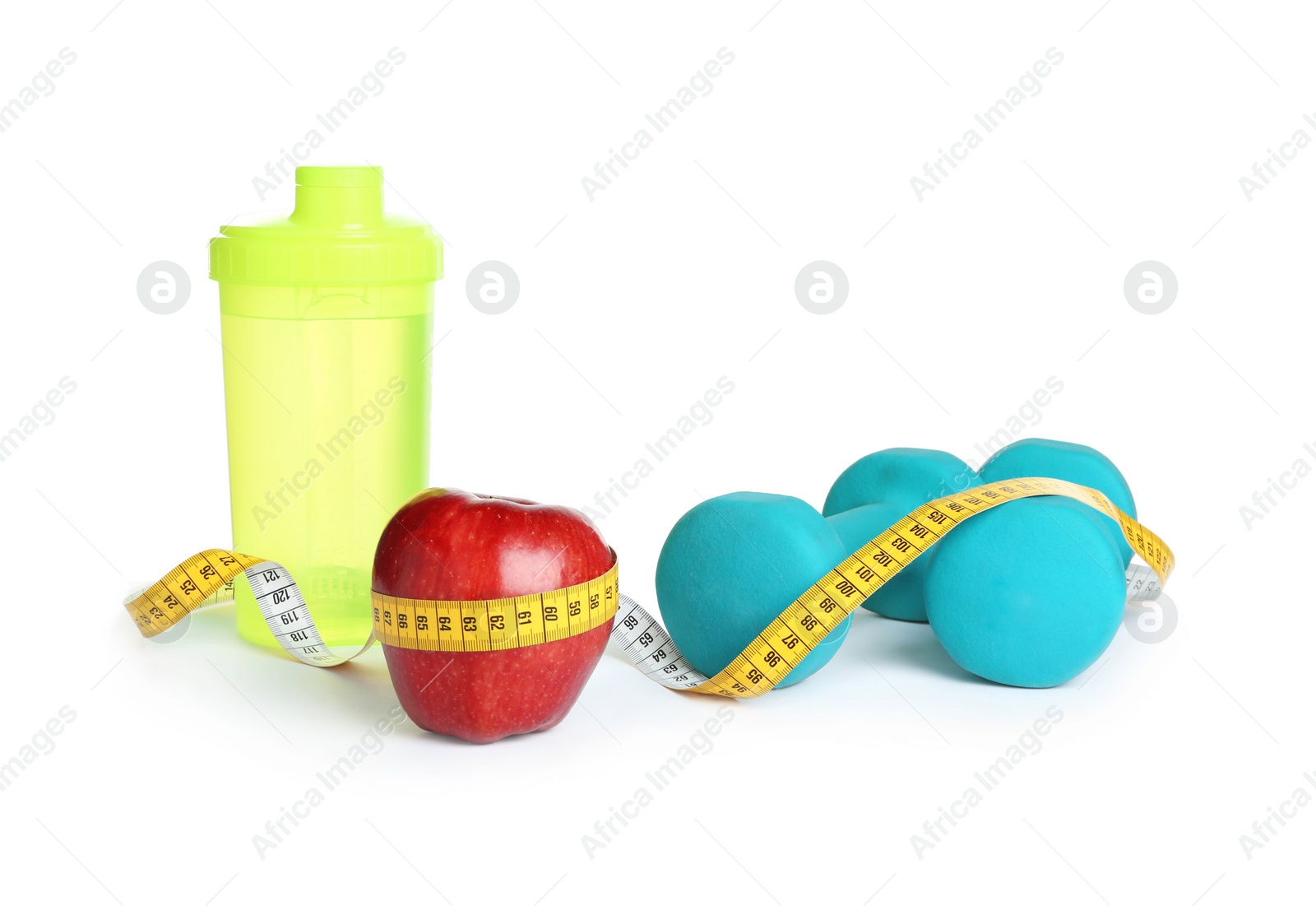 Photo of Apple, measuring tape and dumbbells on white background. Concept of weight loss