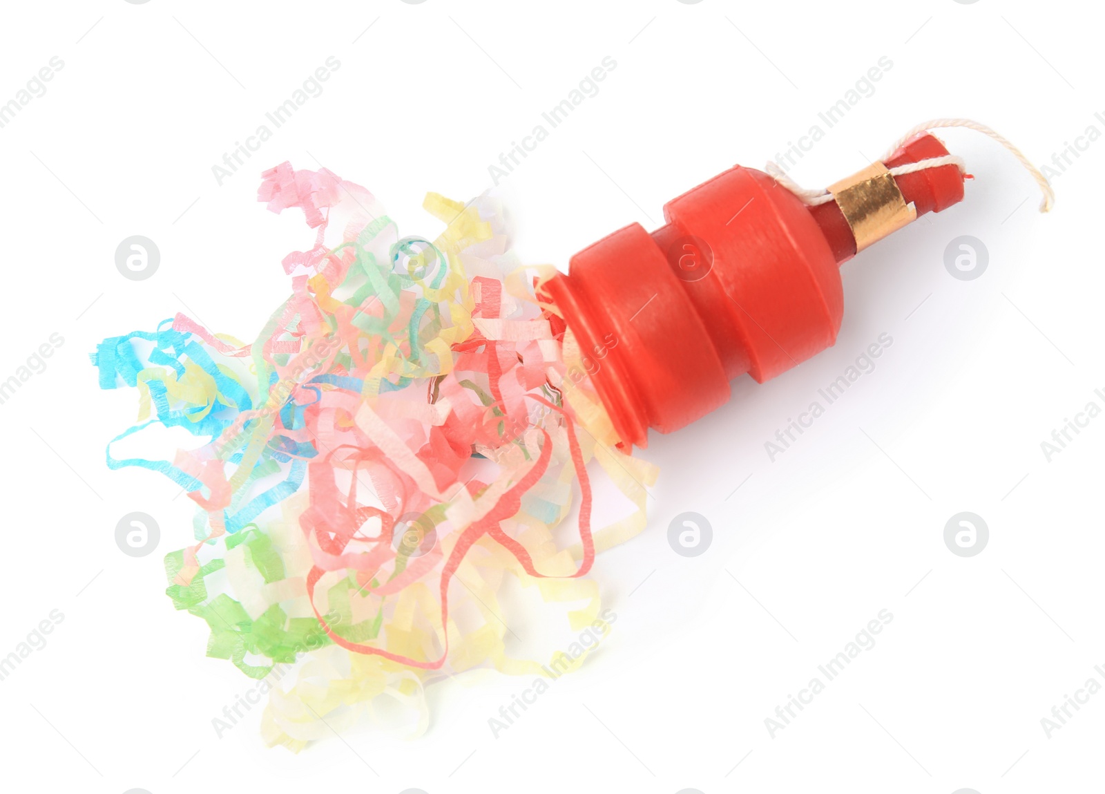 Photo of Colorful streamers with red party cracker isolated on white, top view