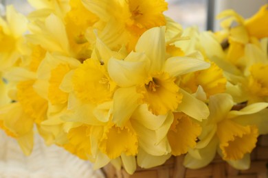 Closeup view of yellow daffodils in wicker basket