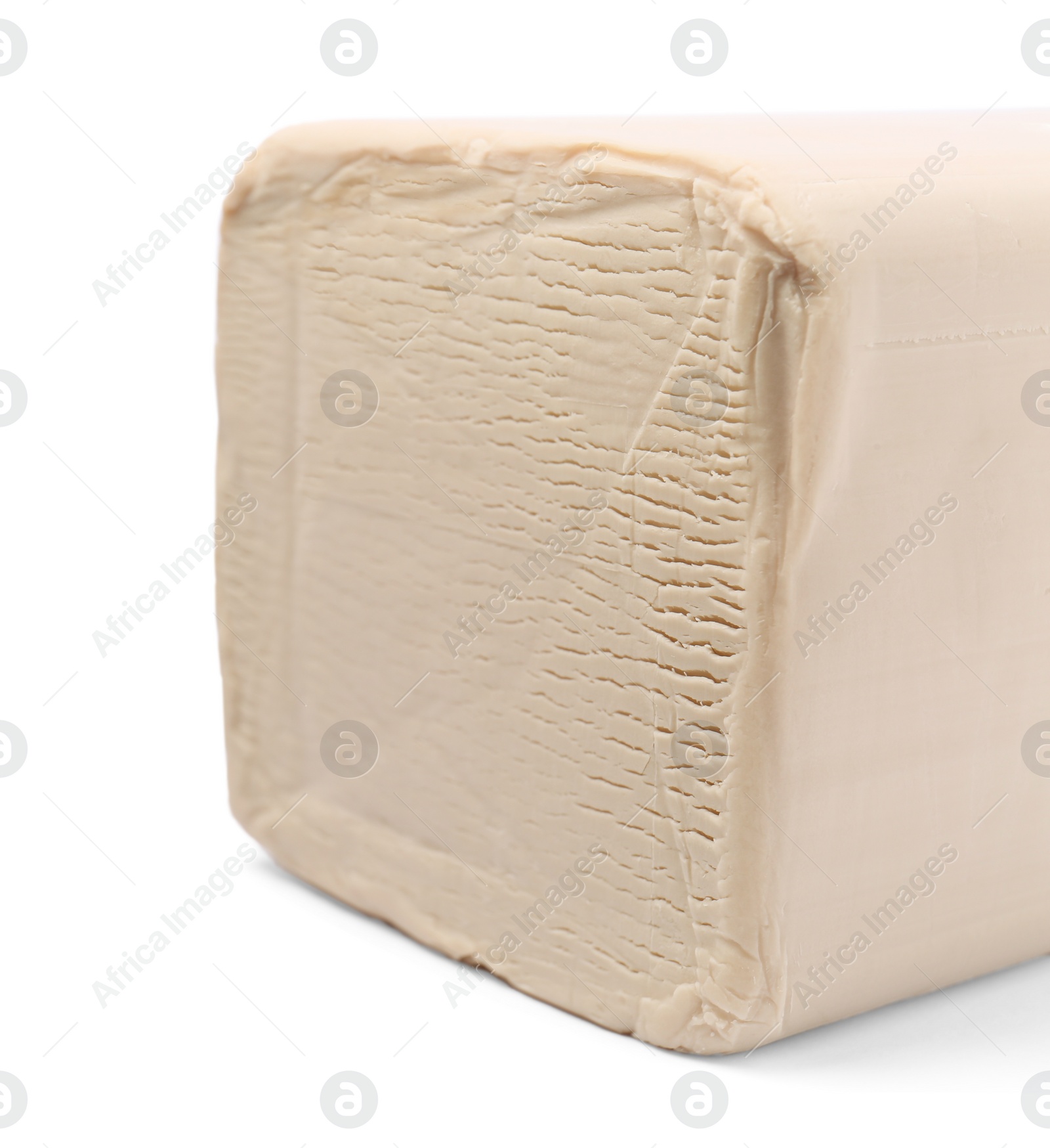 Photo of Block of compressed yeast isolated on white, closeup