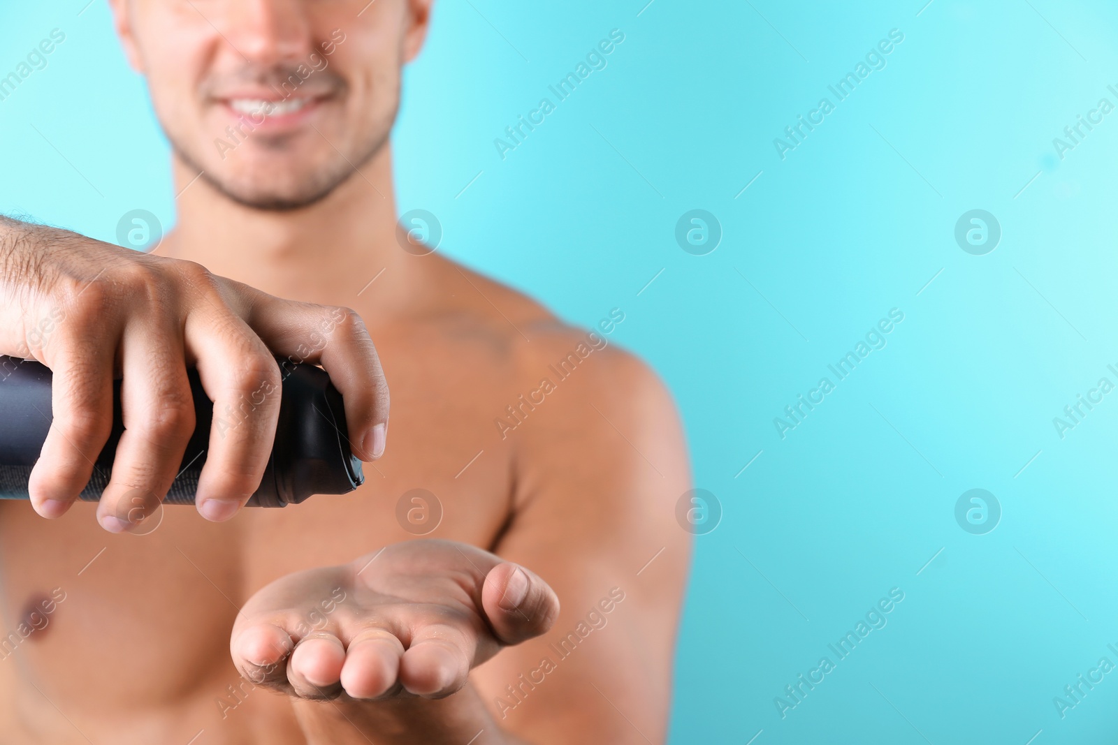 Photo of Young man with shaving foam against color background, closeup. Space for text