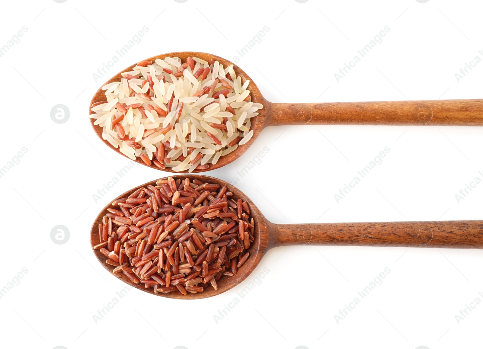 Photo of Brown and polished rice in spoons isolated on white, top view