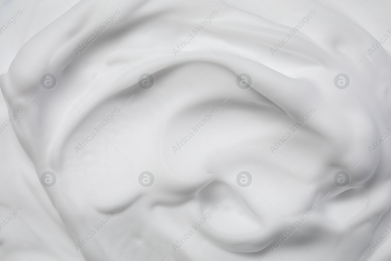 Photo of Texture of white shaving foam as background, top view