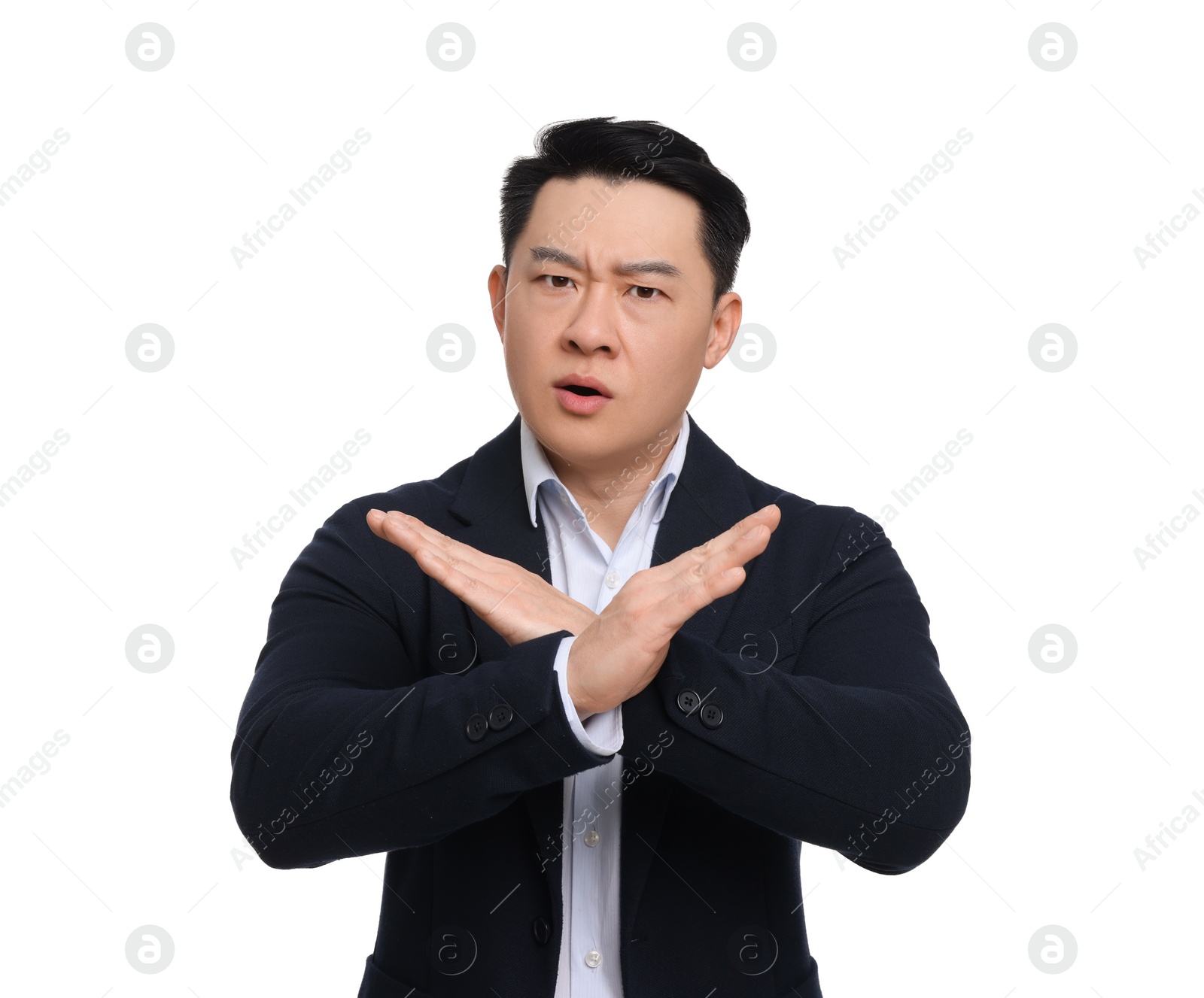 Photo of Angry businessman in suit posing on white background