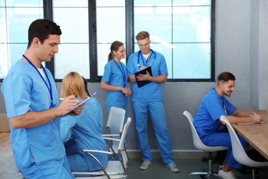 Photo of Medical student with groupmates studying in university library