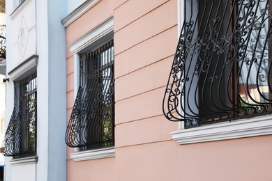 Beautiful windows with grills in building outdoors