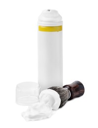 Photo of Bottle with shaving foam and brush on white background