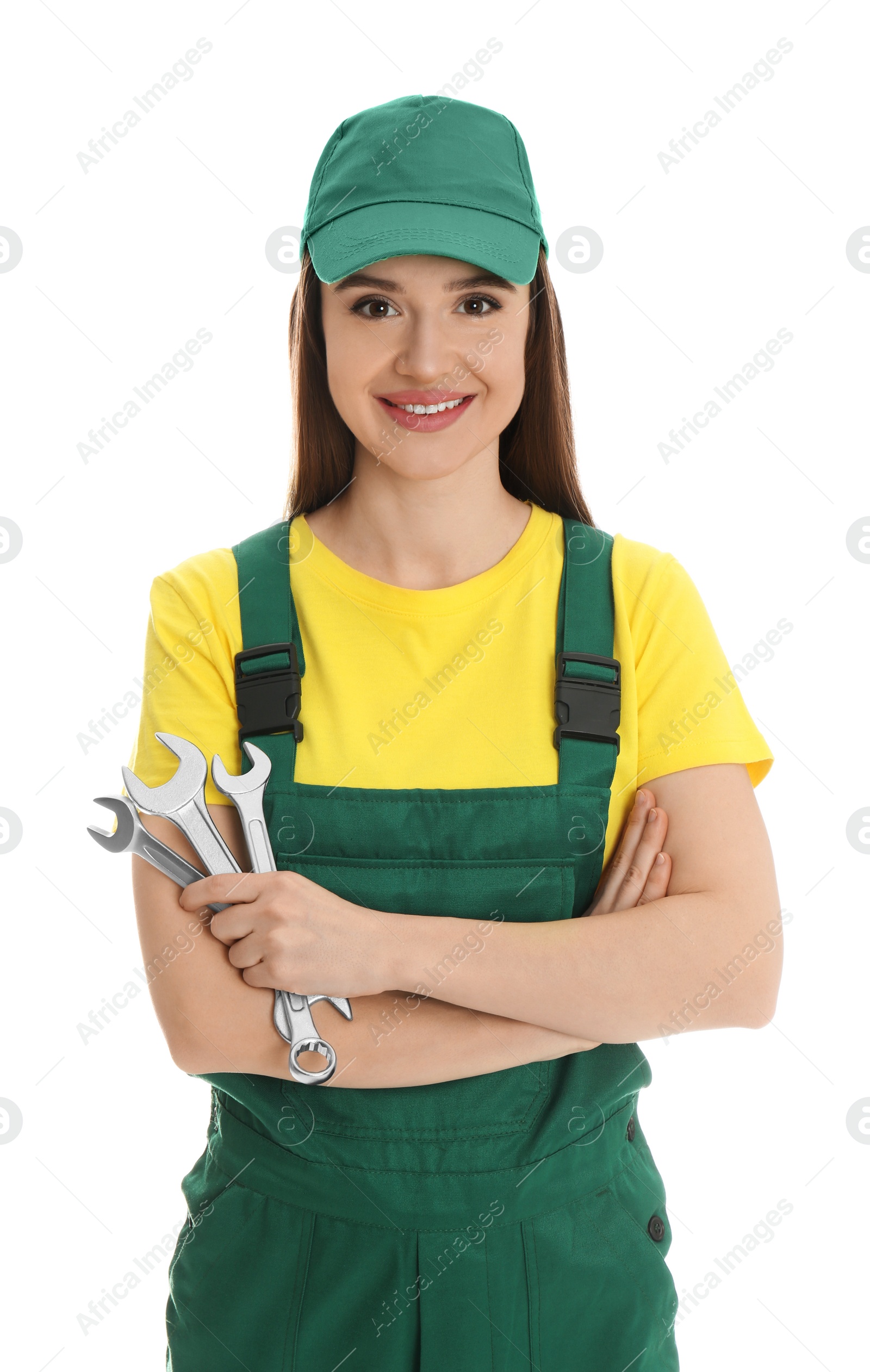 Photo of Portrait of professional auto mechanic with wrenches on white background