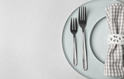 Beautiful table setting on grey background, top view. Space for text