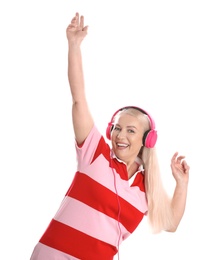 Photo of Mature woman enjoying music in headphones isolated on white