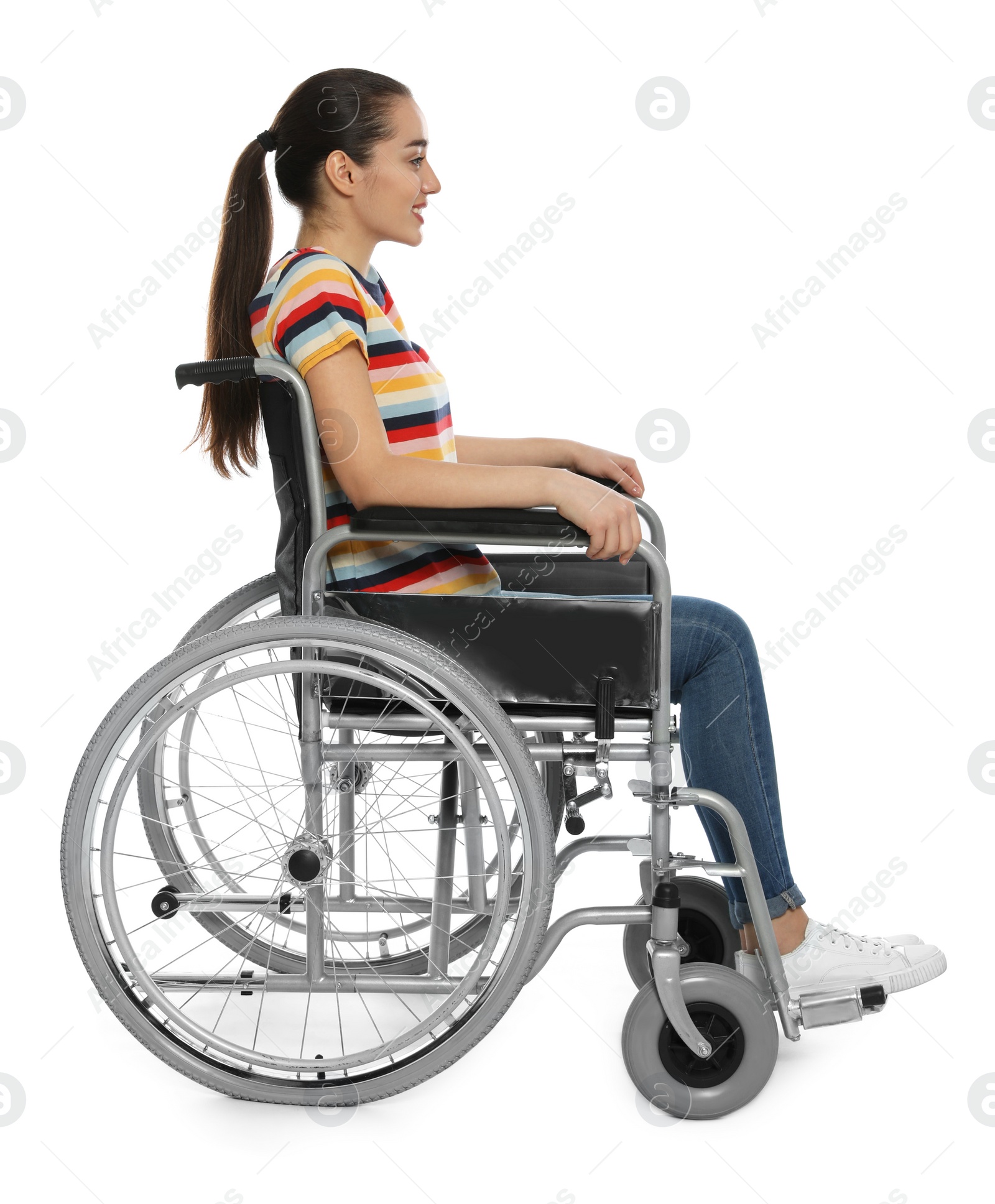 Photo of Young woman in wheelchair isolated on white