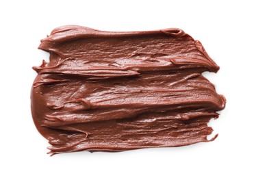 Photo of Smear of tasty chocolate paste on white background, top view
