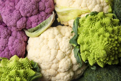 Photo of Different fresh cabbages as background, top view
