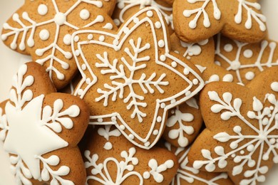 Tasty star shaped Christmas cookies with icing as background, top view