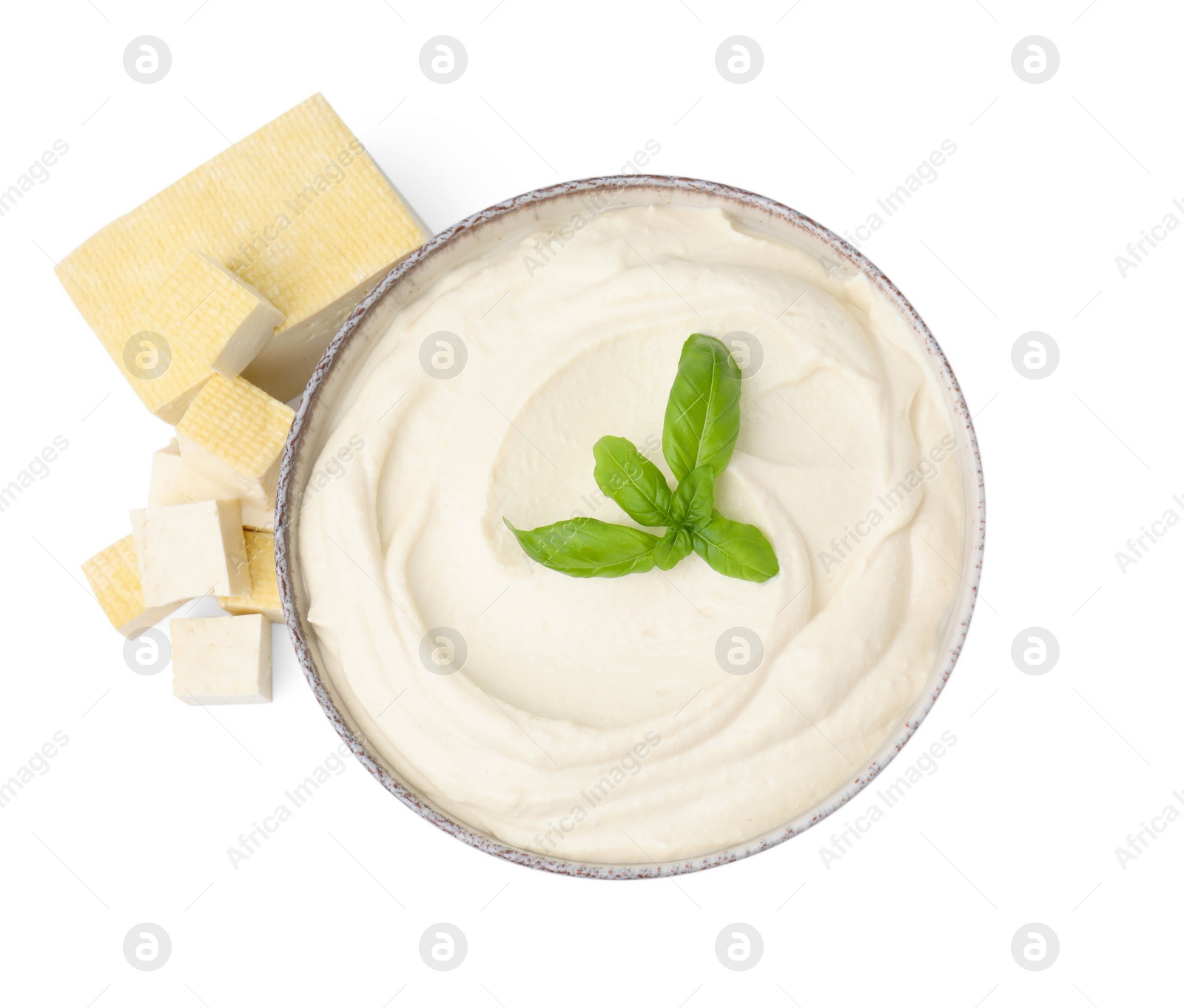 Photo of Delicious tofu, sauce and basil leaves isolated on white, top view