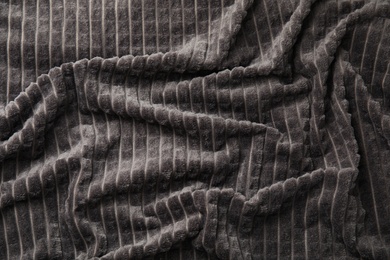 Photo of Soft warm grey plaid as background, closeup