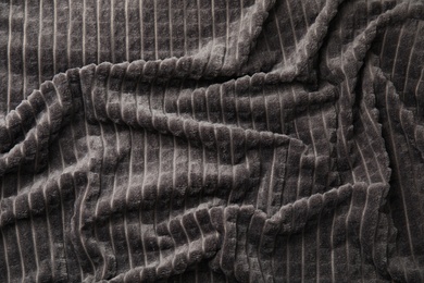 Soft warm grey plaid as background, closeup