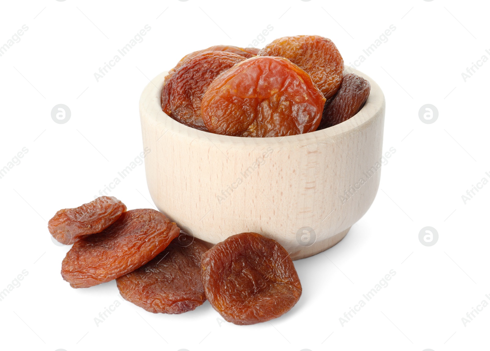 Photo of Ceramic bowl with tasty dried apricots isolated on white