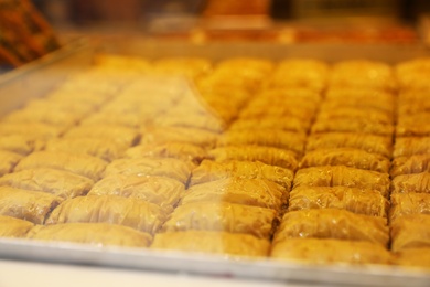 Closeup view of turkish pastries in shop through window glass