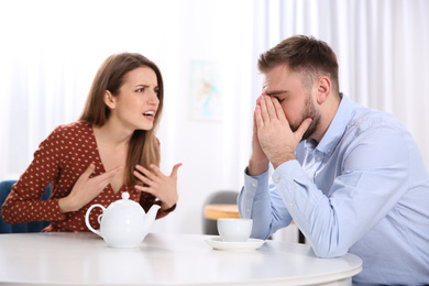 Couple having quarrel in cafe. Relationship problems