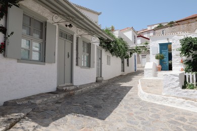 Photo of City street with beautiful buildings on sunny day