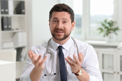 Photo of Portrait of doctor with stethoscope in clinic