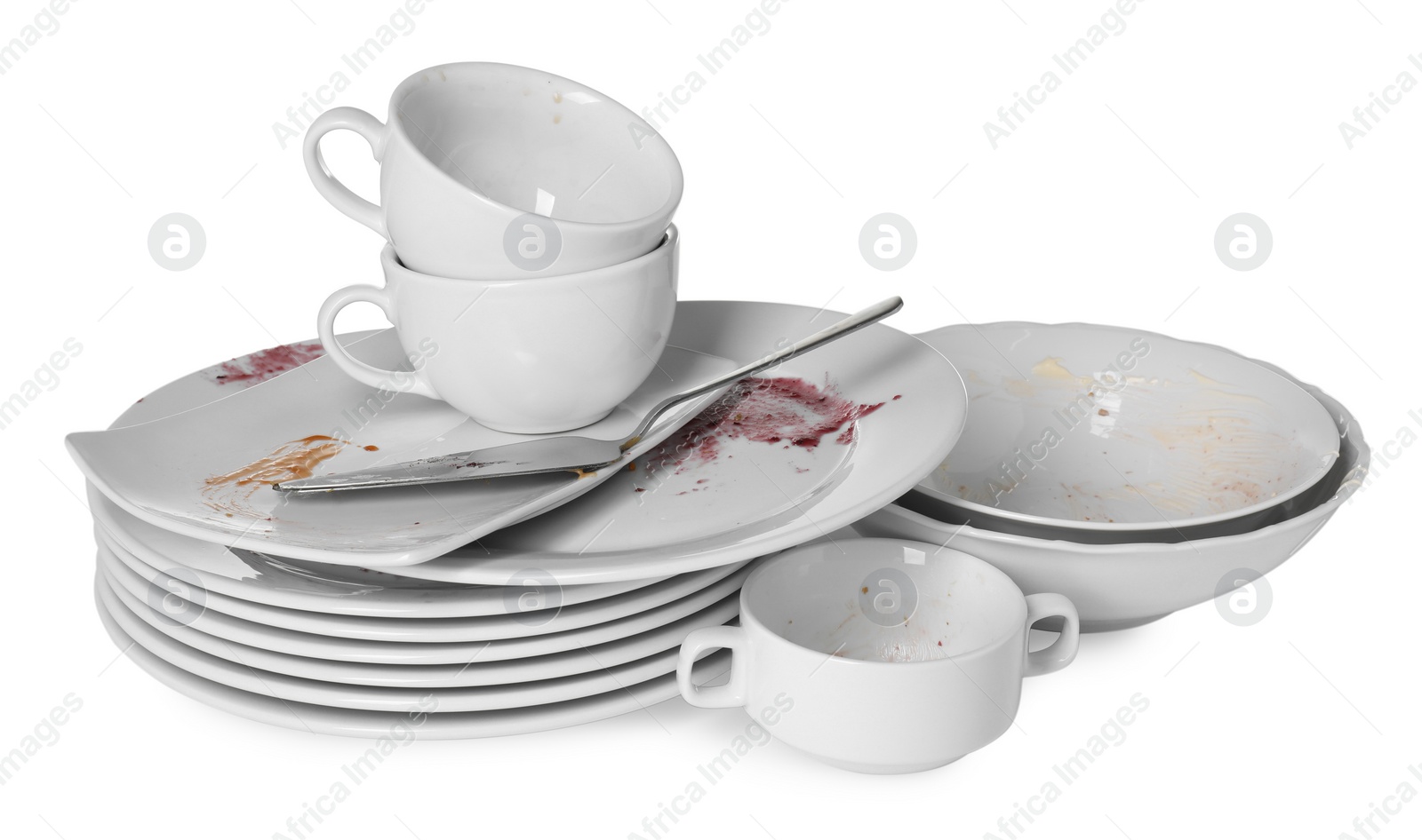 Photo of Set of dirty dishes isolated on white