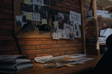 Detective workplace near brick wall in office
