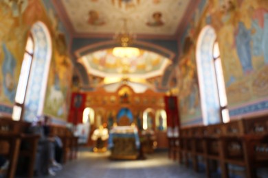 Photo of Blurred view of beautiful church interior with ecclesiastical icons