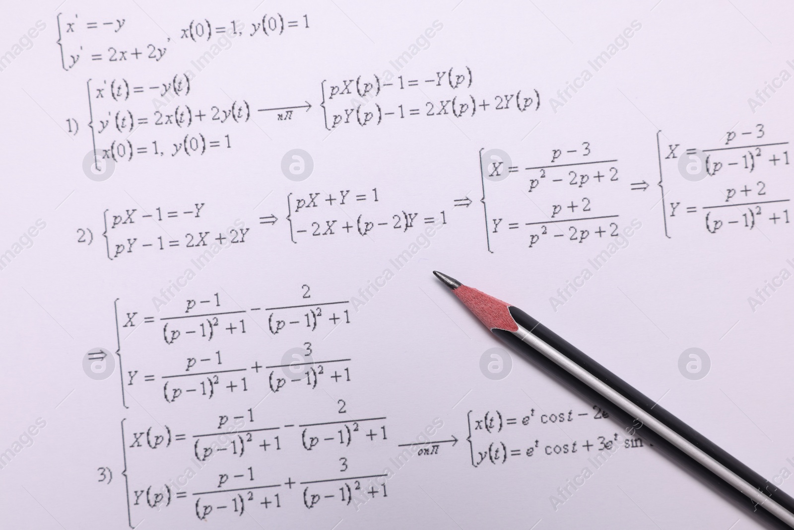 Photo of Sheet of paper with mathematical formulas and pencil, top view
