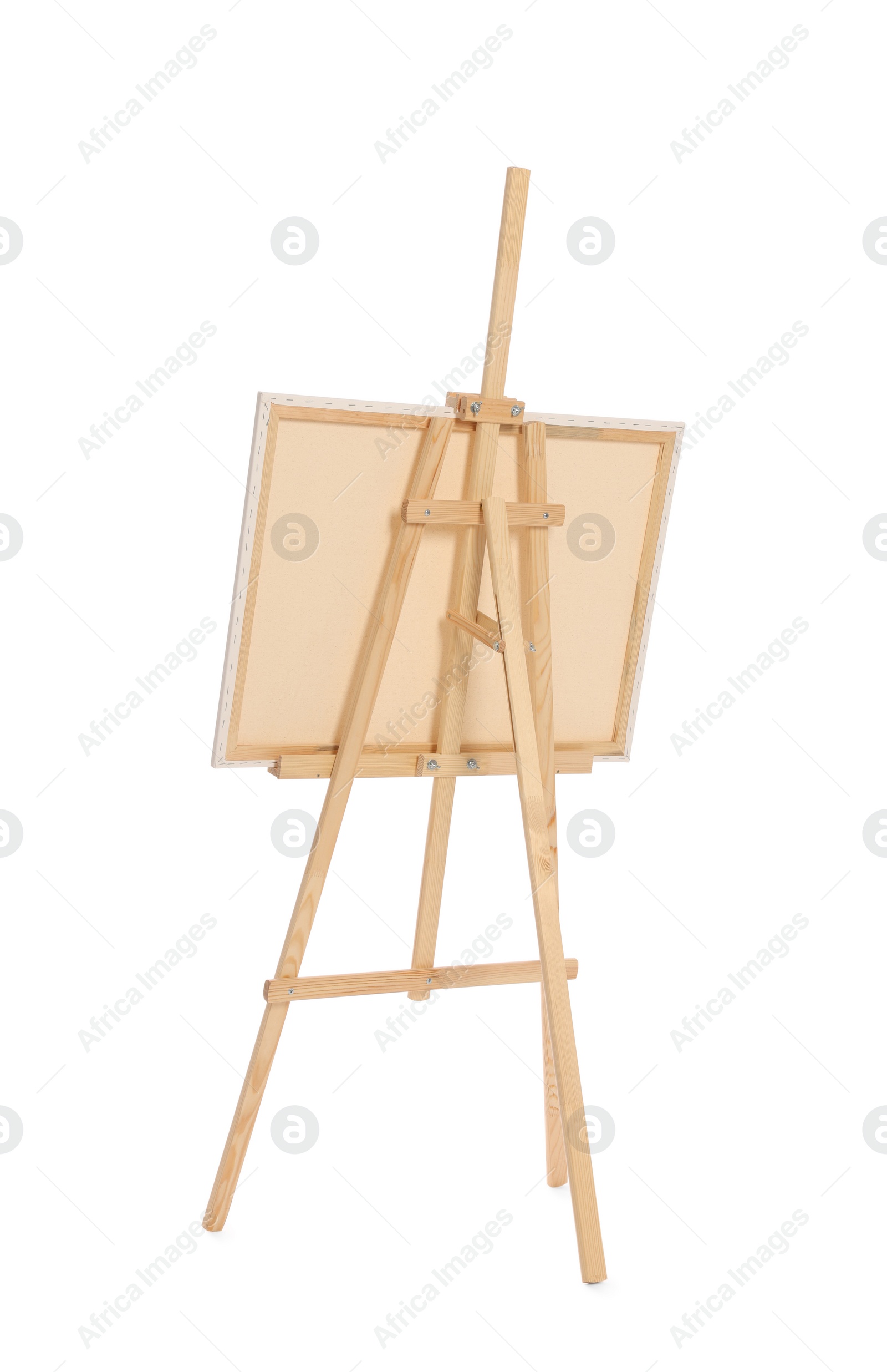 Photo of Wooden easel with canvas isolated on white