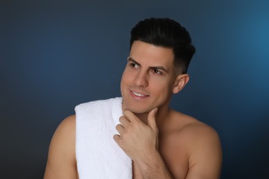 Photo of Handsome man after shaving on blue background