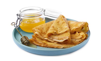 Photo of Delicious crepes with honey on white background