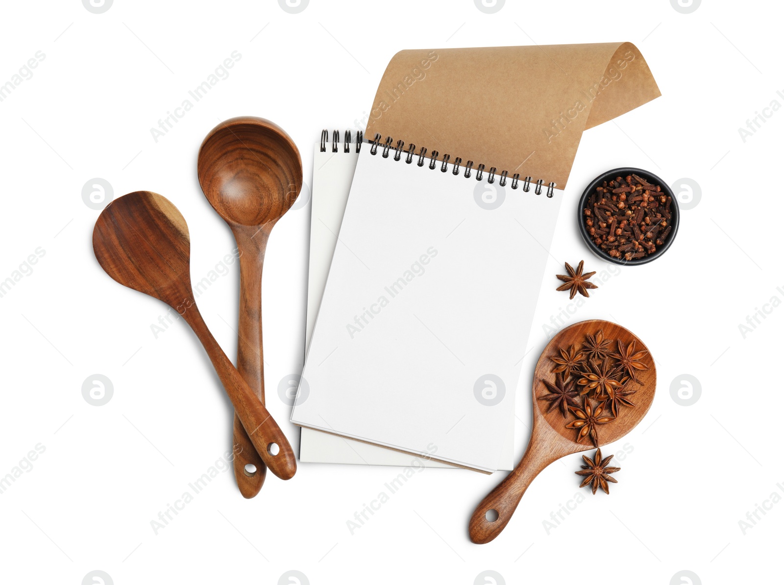 Photo of Blank recipe book, spices and wooden utensils on white background, top view. Space for text