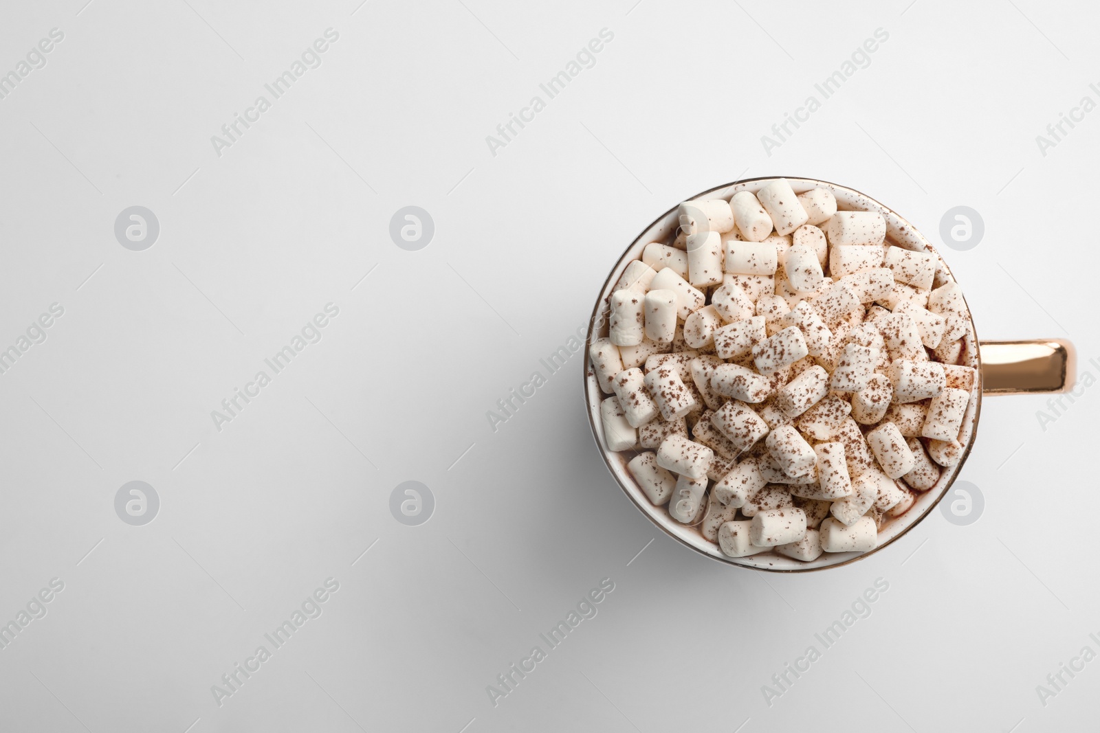 Photo of Delicious cocoa drink with marshmallows on white background, top view