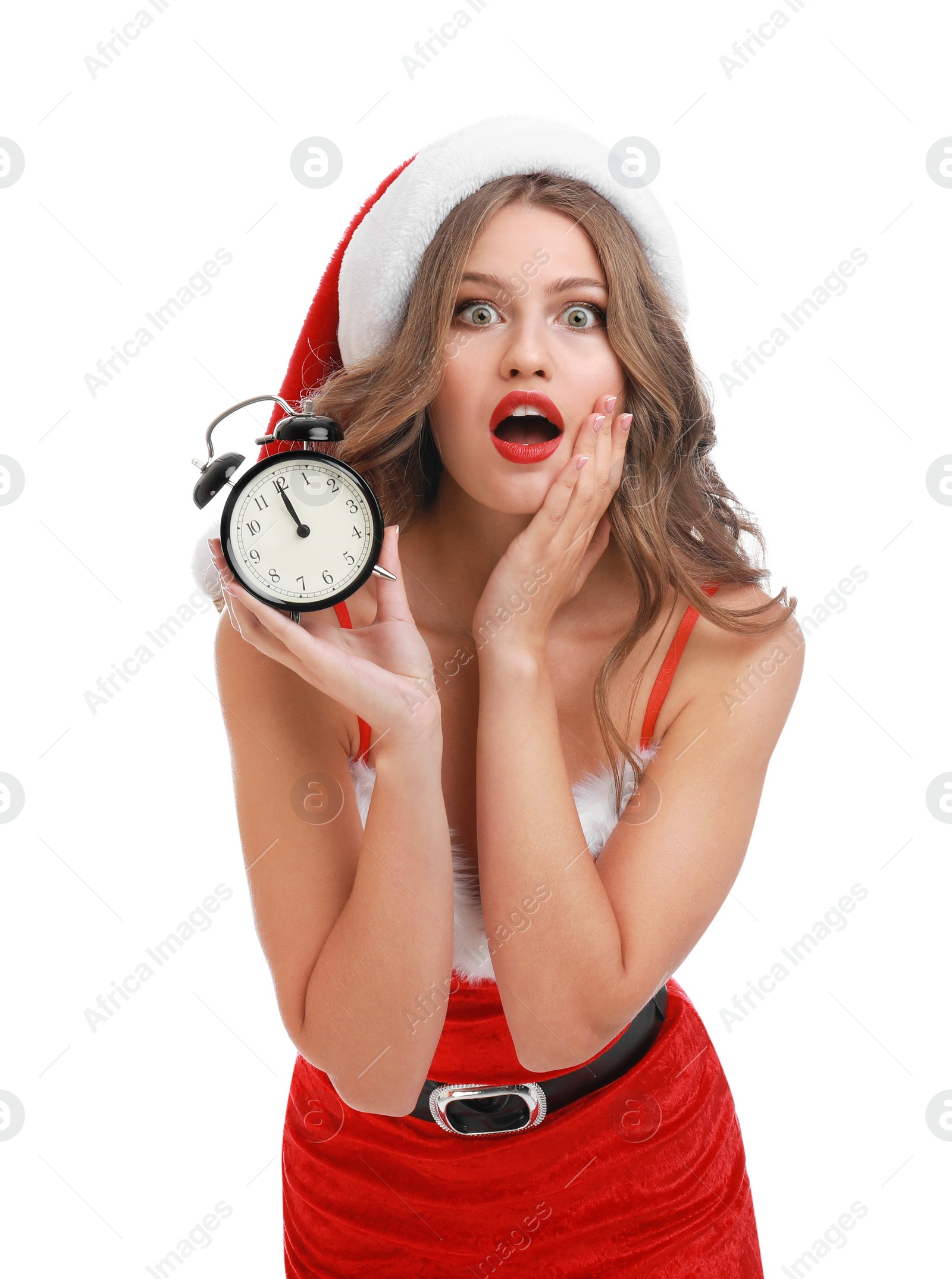 Photo of Beautiful Santa girl with alarm clock on white background. Christmas celebration