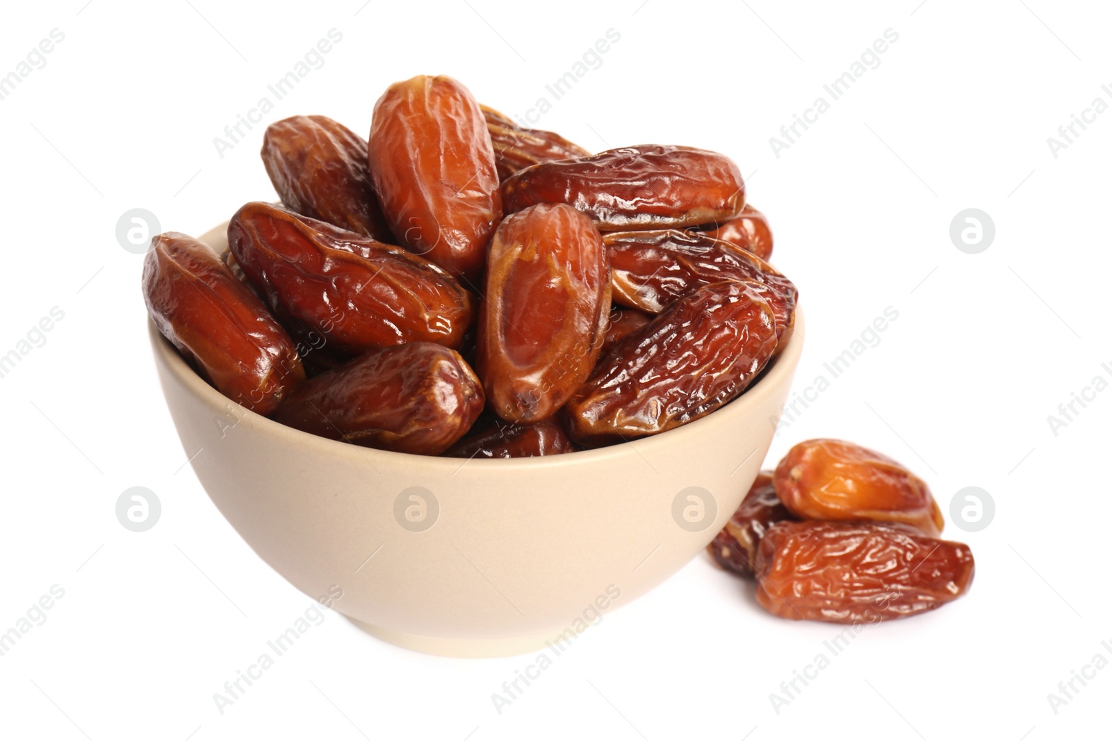 Photo of Sweet dried dates in bowl on white background