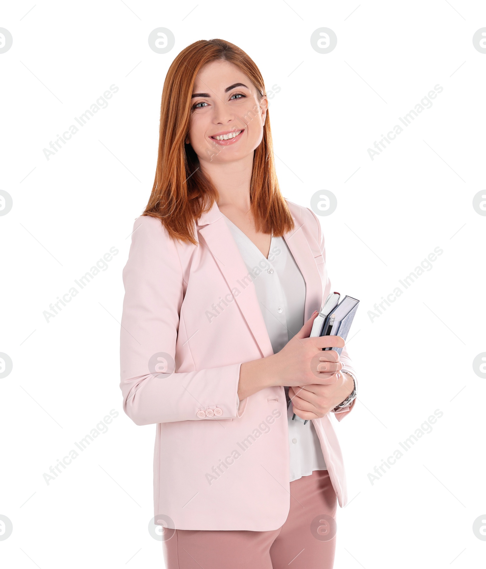 Photo of Beautiful young teacher with notebooks on white background