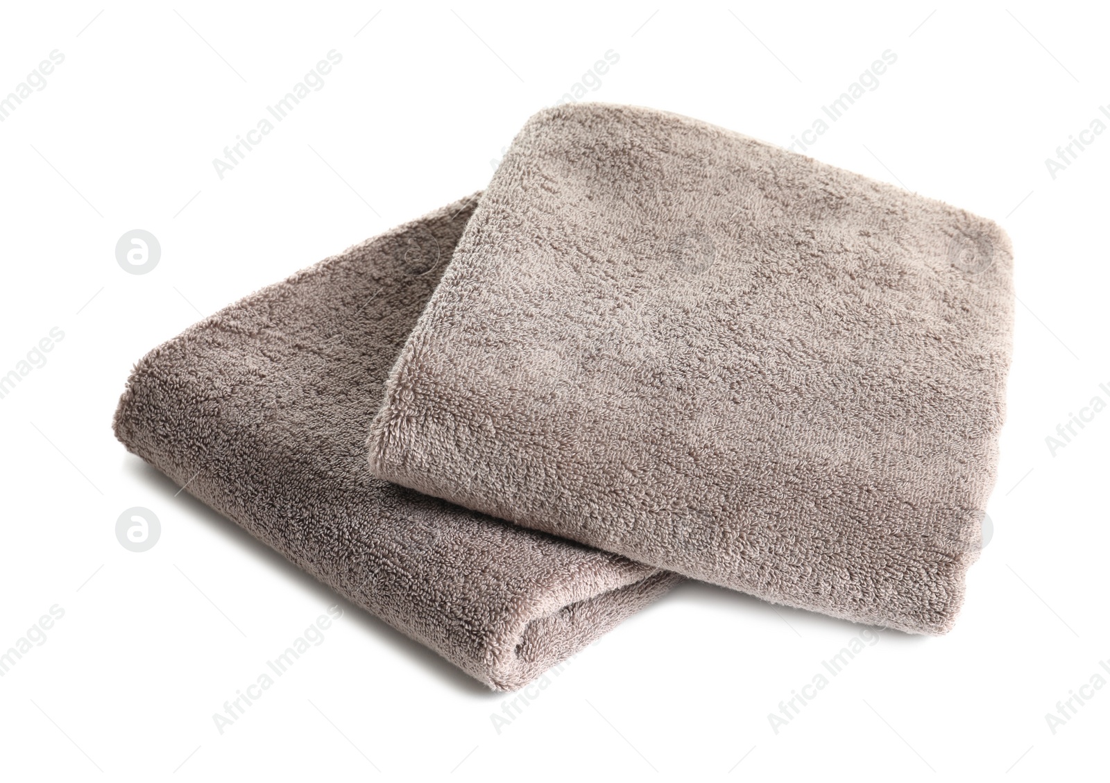 Photo of Fresh soft folded towels isolated on white