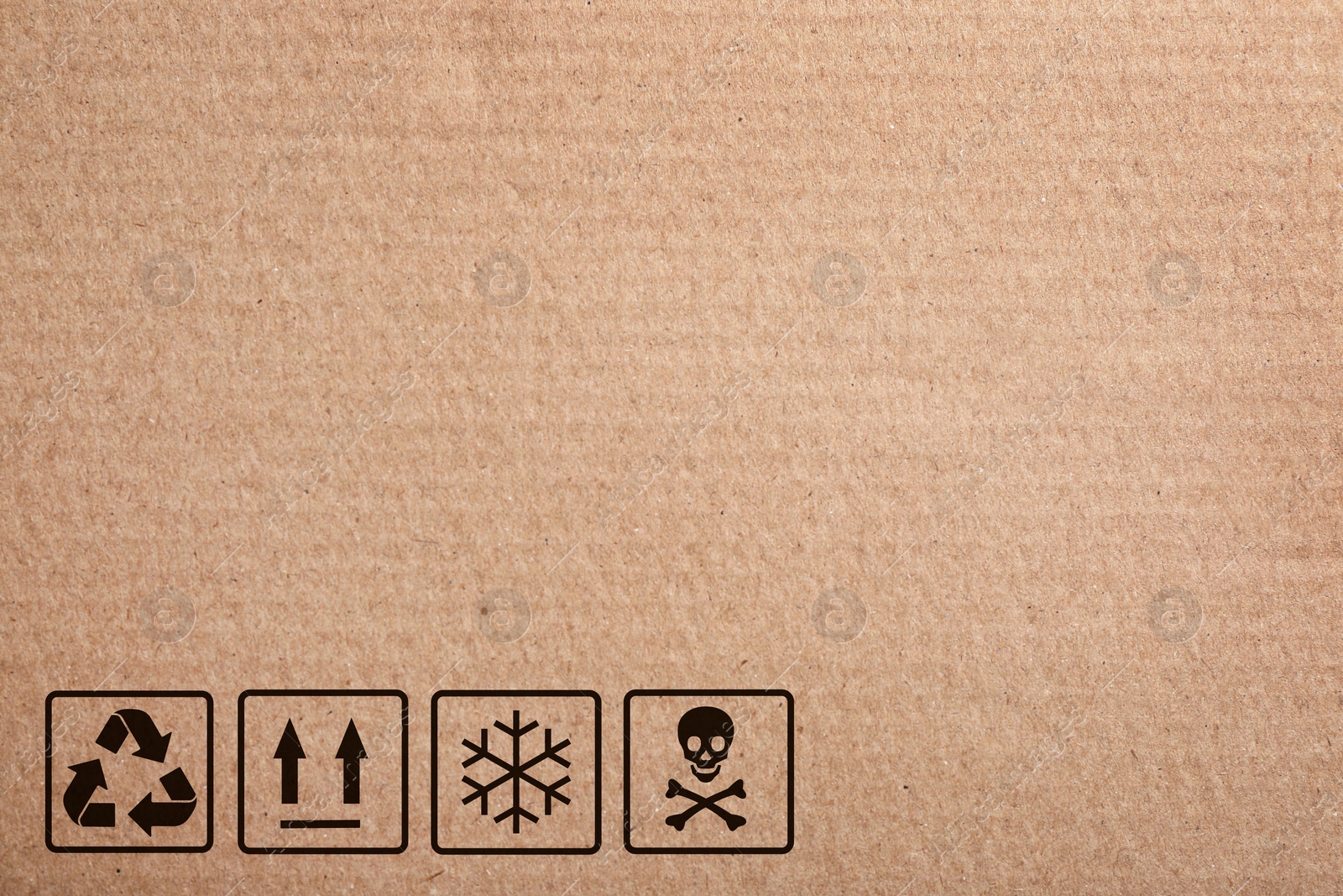 Image of Cardboard box with packaging symbols as background, closeup