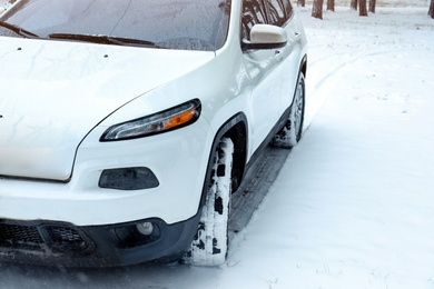 Modern car on snowy road. Winter season