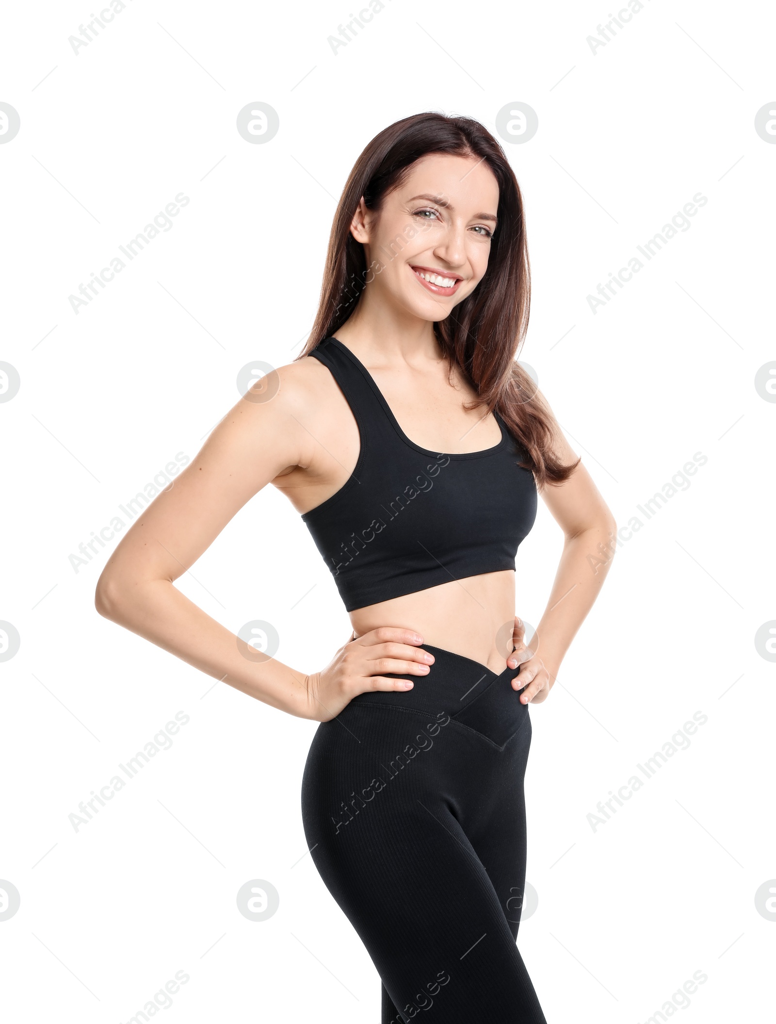 Photo of Happy young woman with slim body posing on white background