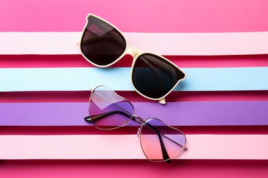 Photo of Different stylish sunglasses on color background, flat lay