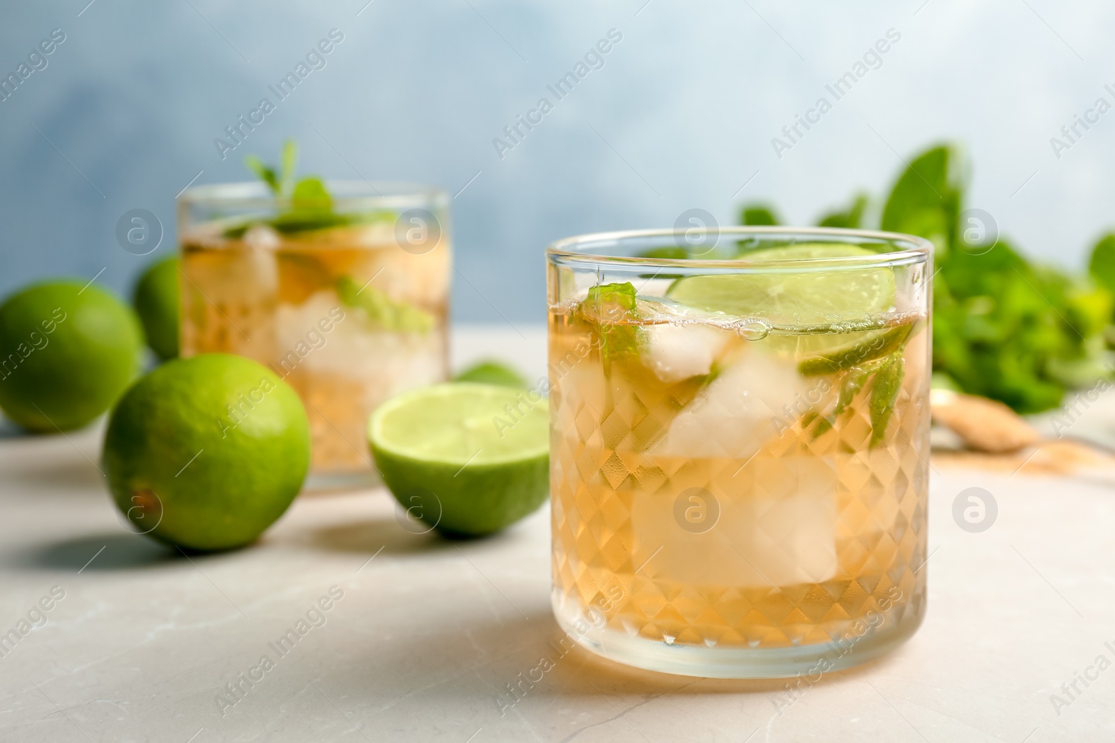 Photo of Composition with delicious mint julep cocktail on table