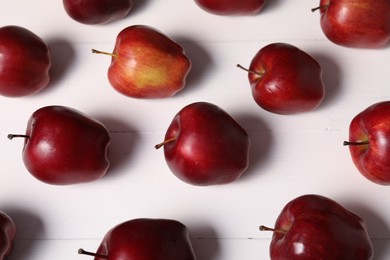 Photo of Fresh red apples on white wooden table